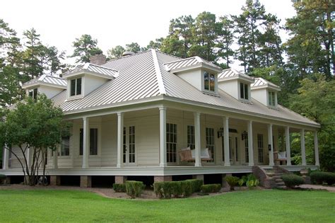 beige house metal roof|beige house with metal roof.